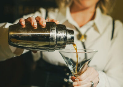 woman pouring cocktail